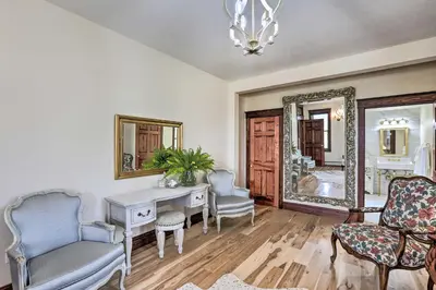 a room with a desk and chairs and a mirror at Mtn View and Group Ready Conifer Home on 100 Acres! in Conifer