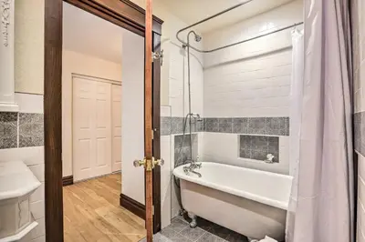 a bathroom with a tub and a toilet and a sink at Mtn View and Group Ready Conifer Home on 100 Acres! in Conifer