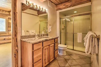 a bathroom with a shower and a sink and a toilet at Skiing and Hiking Access Spacious Granby Cabin! in Granby