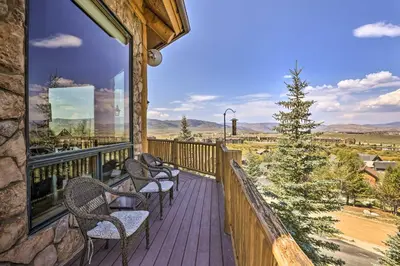 a balcony with chairs and a view of the mountains at Skiing and Hiking Access Spacious Granby Cabin! in Granby