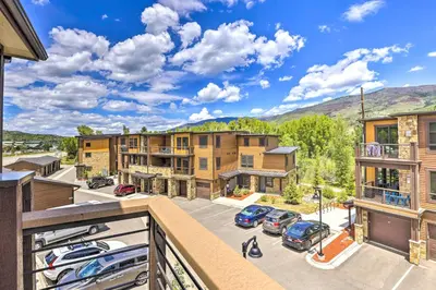 a balcony with a view of a parking lot at 3 Mi to Dillon Reservoir Condo with Balcony! in Silverthorne