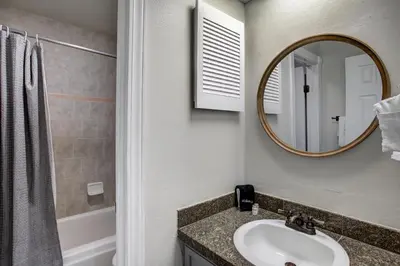 a bathroom with a sink and a mirror at Luxury 2 Bedroom Condo with Pool Hot Tub and Sauna in Keystone