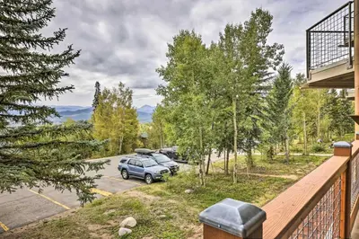a balcony view of a car parked in a parking lot at Silverthorne Condo with Lake Views 10 Mi to Skiing! in Silverthorne