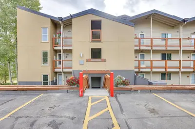 a parking lot in front of a building at Silverthorne Condo with Lake Views 10 Mi to Skiing! in Silverthorne