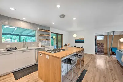 a kitchen with a wooden island with a stove at Less Than 3 Mi to Pearl St Home with Large Yard in Boulder in Boulder