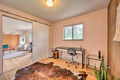 a living room with a sliding door leading to a living room at Less Than 3 Mi to Pearl St Home with Large Yard in Boulder in Boulder