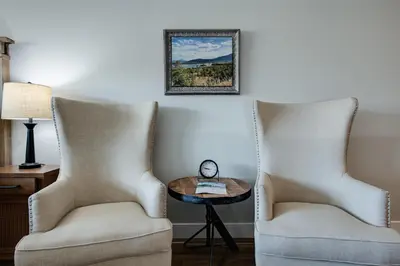 a room with two chairs and a table and a picture at Cedar Lodge Buffalo Studio Condo: Great Frisco Location in Frisco
