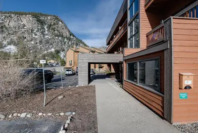 a doorway to a building with a mountain in the background at Cedar Lodge Buffalo Studio Condo: Great Frisco Location in Frisco