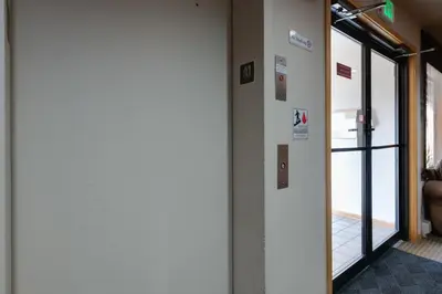 a hallway with a door leading into a room at Cedar Lodge Buffalo Studio Condo: Great Frisco Location in Frisco