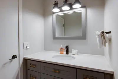 a bathroom with a sink and a mirror at Cedar Lodge Buffalo Studio Condo: Great Frisco Location in Frisco
