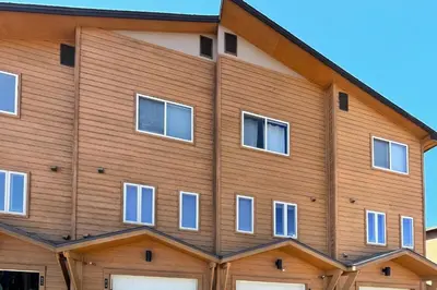 a building with many windows on the side of it at Cozy Fraser Cabin in Fraser