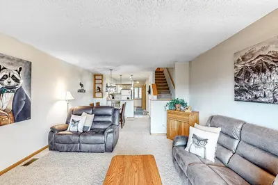 a living room with a couch and chairs and a table at Cozy Fraser Cabin in Fraser