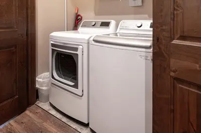 a washer and dryer sitting in a kitchen at Elk Creek Condos B103 by Stay Winter Park in Fraser