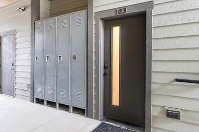 a door of a building with lockers on it at Elk Creek Condos B103 by Stay Winter Park in Fraser