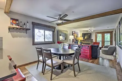 a kitchen and dining room with a table and chairs at Main Street Frisco Condo with Private Patio! in Frisco