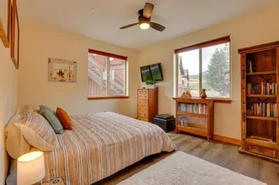 a bedroom with a bed and a ceiling fan at Ski and Explore Silverthorne Gem with Hot Tub Access! in Silverthorne