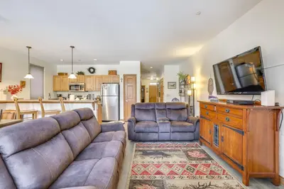 a living room with a couch and a tv at Ski and Explore Silverthorne Gem with Hot Tub Access! in Silverthorne