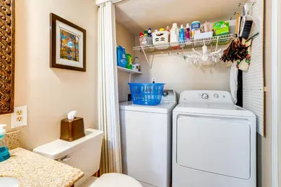 a small bathroom with a washing machine in it at Less Than 1 Mi to Dtwn Creekside Frisco Home with Fire Pit in Frisco