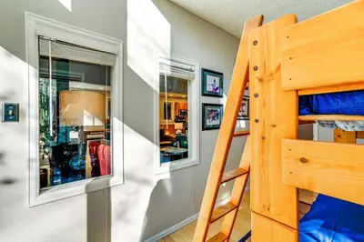 a bedroom with a bunk bed and a ladder at Less Than 1 Mi to Dtwn Creekside Frisco Home with Fire Pit in Frisco
