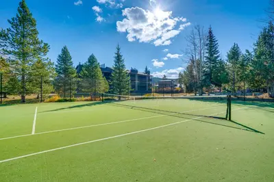 a tennis court with a net on top of it at Less Than 1 Mi to Dtwn Creekside Frisco Home with Fire Pit in Frisco