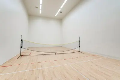 a basketball court with a net in a room at Less Than 1 Mi to Dtwn Creekside Frisco Home with Fire Pit in Frisco