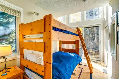 a bedroom with two bunk beds in a room at Less Than 1 Mi to Dtwn Creekside Frisco Home with Fire Pit in Frisco