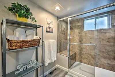 a bathroom with a shower with a glass door at Fenced Yard and Patio Pet-Friendly Denver Home Base in Arvada