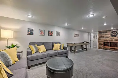 a living room with a couch and a table at Fenced Yard and Patio Pet-Friendly Denver Home Base in Arvada