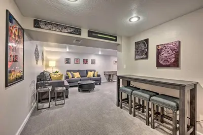 a living room with a couch and a table and chairs at Fenced Yard and Patio Pet-Friendly Denver Home Base in Arvada