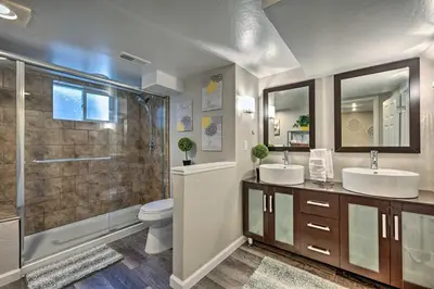 a bathroom with two sinks and a shower at Fenced Yard and Patio Pet-Friendly Denver Home Base in Arvada