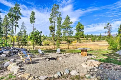 a fire pit with a bench and a picnic table at Less Than 1 Mi to Lake Granby Log Cabin with Fire Pit in Grand Lake