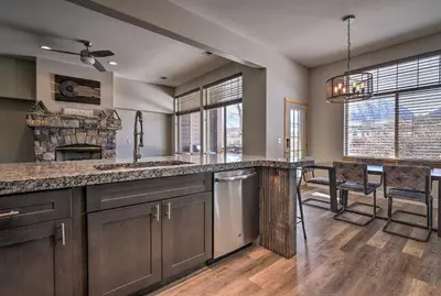 a kitchen with a sink and a counter top at 7 Mi to Keystone Waterfront Home with Scenic Views in Silverthorne