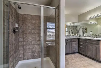 a bathroom with a shower and a bath tub at 7 Mi to Keystone Waterfront Home with Scenic Views in Silverthorne