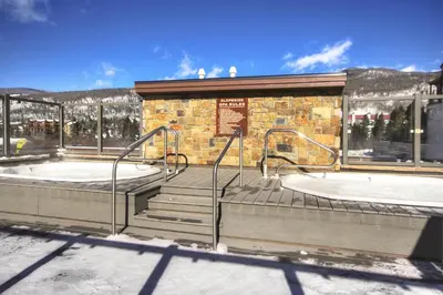 a building with two juzzled hot tubs in it at Slopeside in Keystone