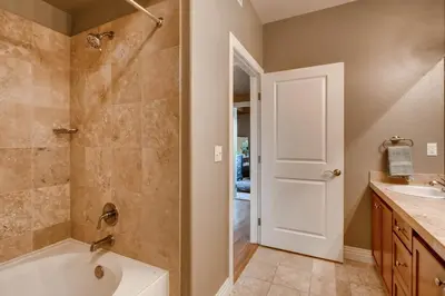 a bathroom with a tub and a sink at Mountain Views Luxury Condo in the DTC in Centennial