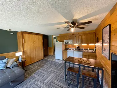 a living room with a couch and a table at Relax, Adventure, Views, Amenities+Memories (Full) in Granby