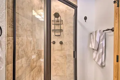 a shower with a glass door in a bathroom at 4 Mi to Grand Lake Mtn-View Cabin with Fire Pit! in Grand Lake
