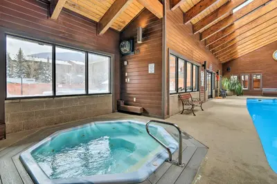 a jacuzzi tub in a room with at Walkable Frisco Condo Mtn Views and Shared Hot Tub! in Frisco