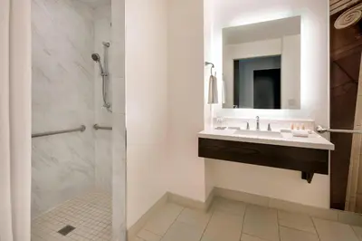 a bathroom with a sink and a shower at Renaissance Denver Downtown City Center Hotel in Denver