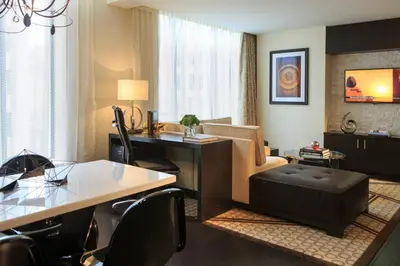 a living room with a table and a couch at Renaissance Denver Downtown City Center Hotel in Denver