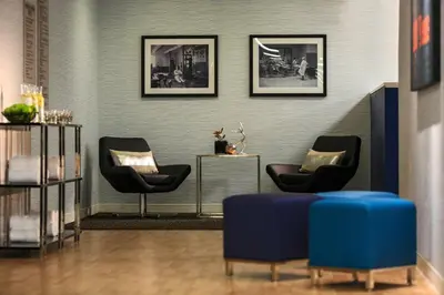 a waiting room with two chairs and a table at Renaissance Denver Downtown City Center Hotel in Denver