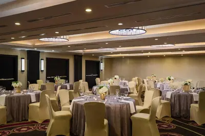 a conference room with tables and chairs and tablesktop at Renaissance Denver Downtown City Center Hotel in Denver
