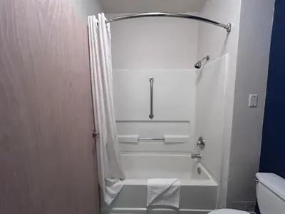 a bathroom with a bath tub and a toilet at Quality Inn Denver Tech Center in Englewood