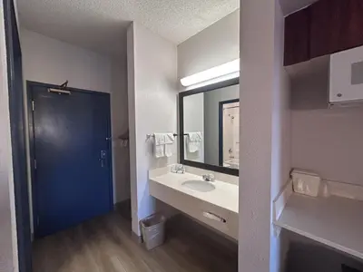 a bathroom with a sink and a mirror at Quality Inn Denver Tech Center in Englewood