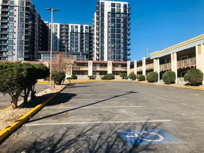 an empty parking lot in front of tall buildings at Inn at the Highland Denver Downtown in Denver