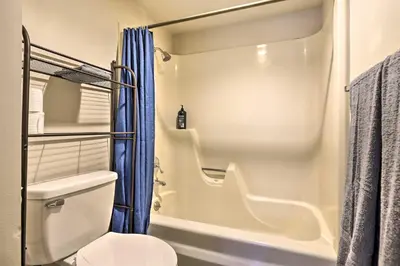 a bathroom with a toilet and a shower at Lakefront Condo with Mtn Views in Dillon! in Dillon