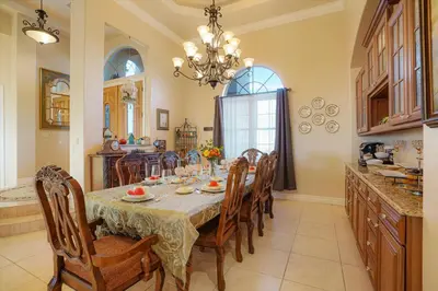 a kitchen and dining room with a table and chairs at Summit Villa BnB in Watkins
