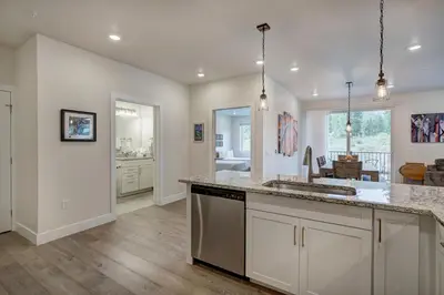 a kitchen with a sink and a counter top at Brand New Clear Water Lofts - 2br Premier Condo - Kids Ski Free! condo in Keystone