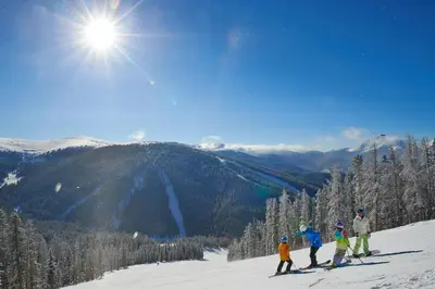 a group of people standing on top of a ski slope at Brand New Clear Water Lofts - 2br Premier Condo - Kids Ski Free! condo in Keystone