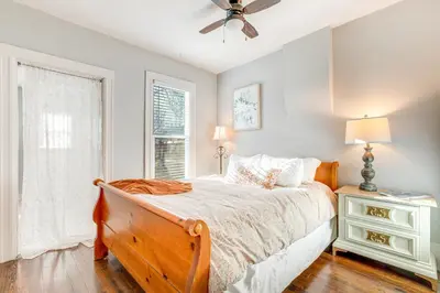 a bedroom with a bed and a ceiling fan at Furnished Patio and Yard Denver Bungalow! in Denver